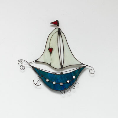 Fantasy boat turquoise with cream sails